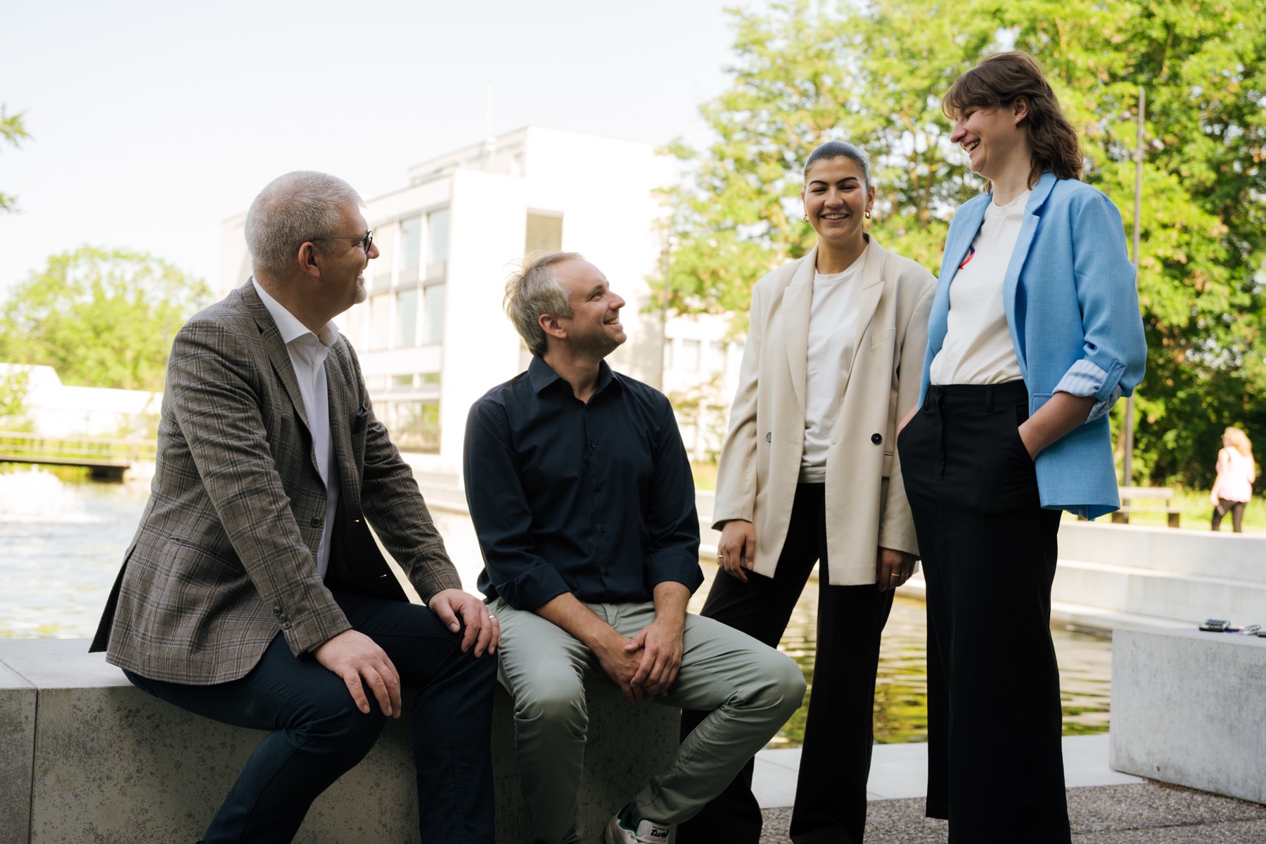 The QustomDot team outside the lab